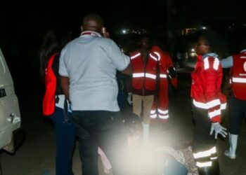 A photo of Keny Red Cross team members attending to a patient from the City Stadium fire incident.