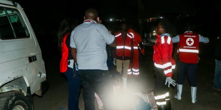 A photo of Keny Red Cross team members attending to a patient from the City Stadium fire incident.