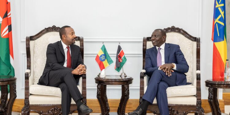 Ethiopia's Prime Minister Abiy Ahmed (left) and President William at State House Nairobi on February 28, 2024. 