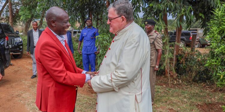 DP Rigathi Gachagua with Retired Bishop Maurice Crowley at at Andrews Kaggwa Catholic Church in Trans Nzoia.