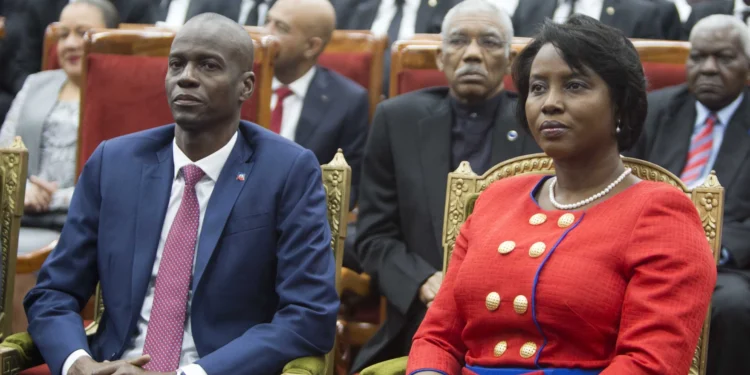 Haiti's President Jovenel Moise sits with his wife Martine during his swearing-in ceremony at Parliament in Port-au-Prince, Haiti, Tuesday Feb. 7, 2017.