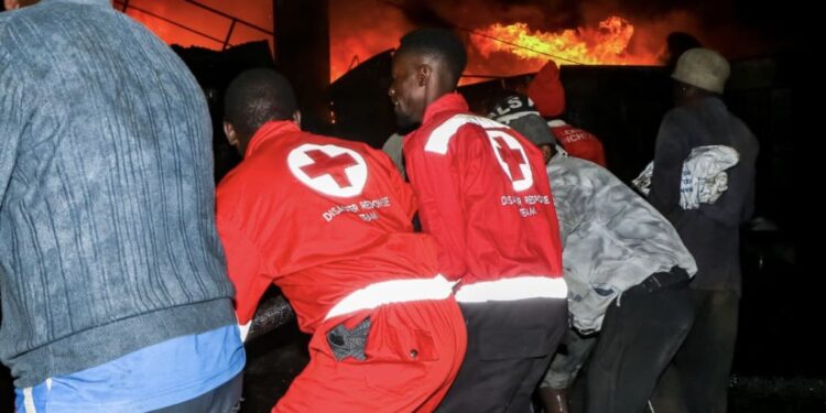 Red Cross Society Members providing services at City Stadium, Nairobi after a fire Outbreak on 30th January.