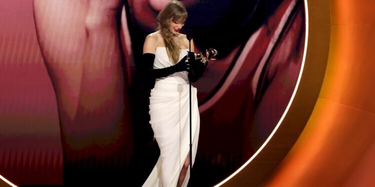 Taylor Swift giving a speech at the Grammys awards ceremony