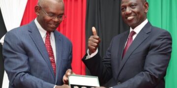 Central Bank of Kenya (CBK) Governor Kamau Thugee (left0 and President William Ruto pose for a photo in a past function. photo/courtesy