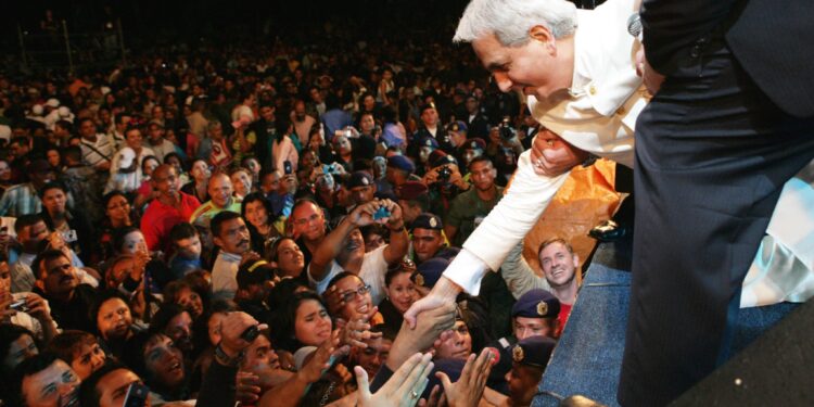 Benny Hinn interacts with congregants in a past crusade. 