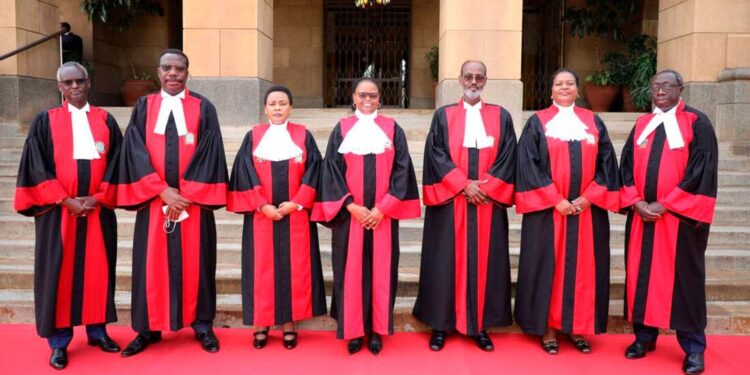 Supreme Court judges pose for a photo outside the SCOK.