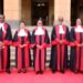 Supreme Court judges pose for a photo outside the SCOK.