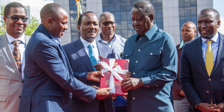 Azimio leader Raila Odinga receives the NADCO report from co-chairs Kalonzo Musyoka and Kimani Ichung'wah. PHOTO/Raila X.