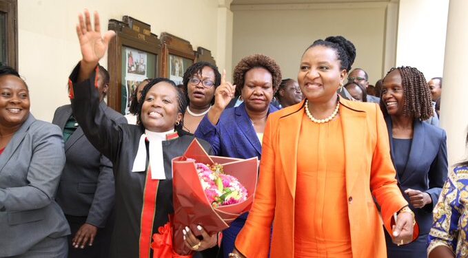 CRJ Winfridah Mokaya celebrates with immediate former CRJ Anne Amadi shortly after being sworn in as the new Chief Registrar of the Judiciary.