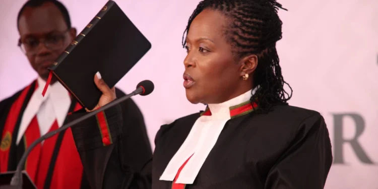 Chief Registrar of the Judiciary Winfridah Mokaya takes the oath of office during her swearing-in at the Supreme Court in Nairobi on March 25, 2024. | PHOTO: Judiciary