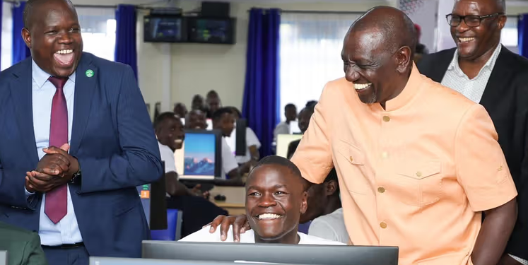President William Ruto with a Remotasks user Brian Kipchumba at Kaiboi National Polytechnic. PHOTO/ PCS