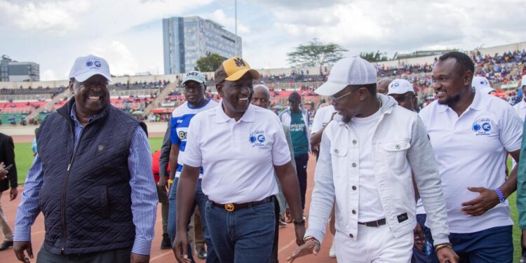 Sports Cabinet Secretary Ababu Namwamba (second from right) and President William Ruto (center0 arrive at the Nyayo Stadium on March 24, 2024.