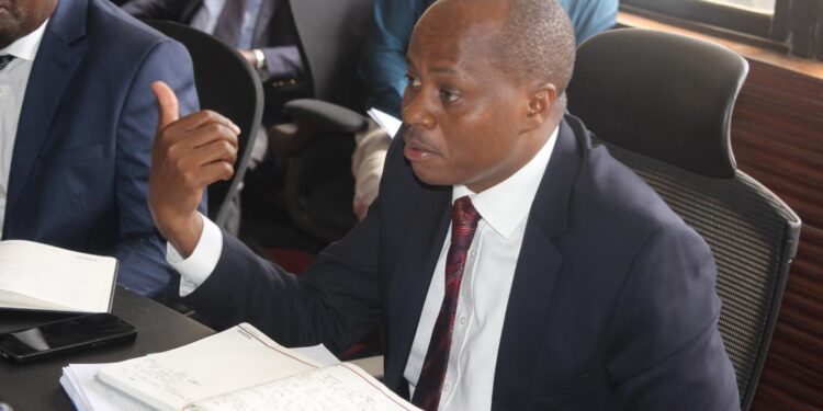 KEMSA Acting CEO Dr Andrew Mulwa speaking during a committee session in parliament.