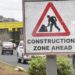 Photo of construction warning road sign
