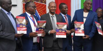 Dr. Moses Kiarie (Centre) from the Deputy Director Quality Assurance, Ministry of Education, with Mandera South MP Abdul Haro (Right) launches the Usawa Agenda SESS 2024 Report) at KICD, Nairobi, on Wednesday April 24, 2024.