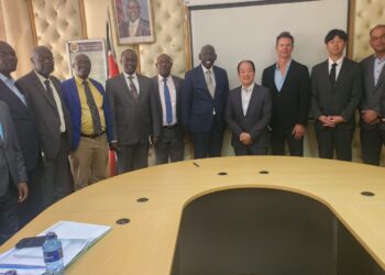 PS Belio Kipsang and Seiko Epson CEO (centre) pose for group photo with officials from the ministry and EPSON company. PHOTO/Min of Edu