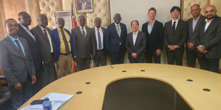 PS Belio Kipsang and Seiko Epson CEO (centre) pose for group photo with officials from the ministry and EPSON company. PHOTO/Min of Edu