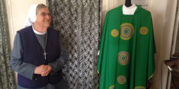 Sister Ida Lagonegro next to one of the Pope's Vetements she made. PHOTO/Courtesy