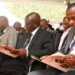 MP John Kiarie (R) sits next to President Ruto during the funeral ceremony of the MP's father. PHOTO/ Kiarie