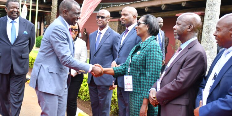 President William Ruto greets SRC Chair Lyn Mengich during Wage Bill Conference 2024. PHOTO/SRC