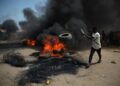 Protesters set tires on fire on the Kaduna-Abuja highway | AFP