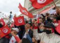 Tunisian demonstrators chant slogans and wave their country's national flag in support of President Kais Saied, in the capital Tunis | AFP