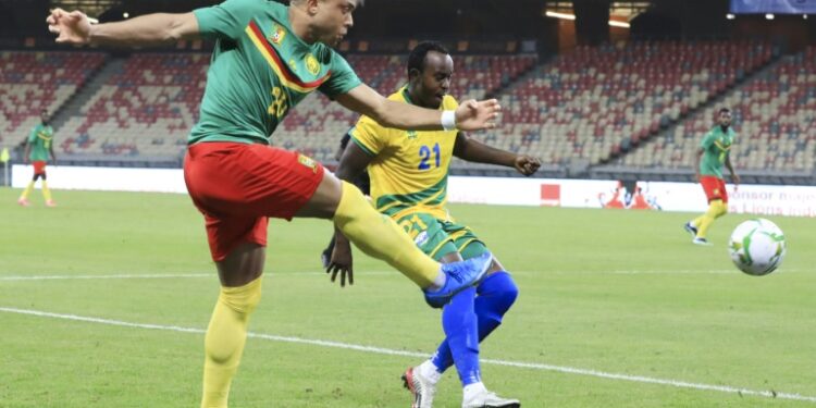 AFP - 
Olivier Miyonzima (R) of Rwanda cannot prevent Pierre Kunde (L) of Cameroon shooting during an Africa Cup of Nations qualifier in Douala on Tuesday.