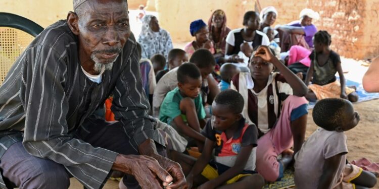 AFP | Belem Boureima, a 74-year-old farmer, and his family. They are among more than a million people who have fled their homes since Burkina Faso's jihadist insurgency began in 2015
