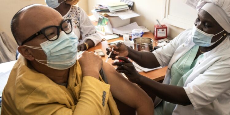 AFP | 
A man gets a dose of the Oxford/AstraZeneca vaccine against Covid-19 at Ngor Clinic in Dakar