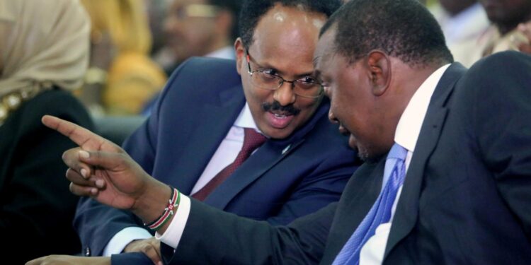Somalia’s president Mohamed Abdullahi Farmaajo (L) listens to Kenya’s President Uhuru Kenyatta | Photo Courtesy
