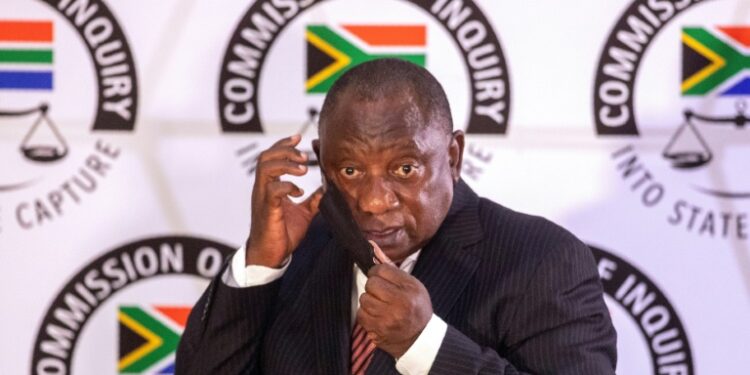 President Cyril Ramaphosa dons a face mask at his appearance before the Zondo Commission in April | AFP