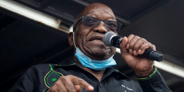 Zuma addressing his supporters camped outside his rural home on Sunday. He has mounted a last-ditch bid to head off a jail term for contempt of court | AFP