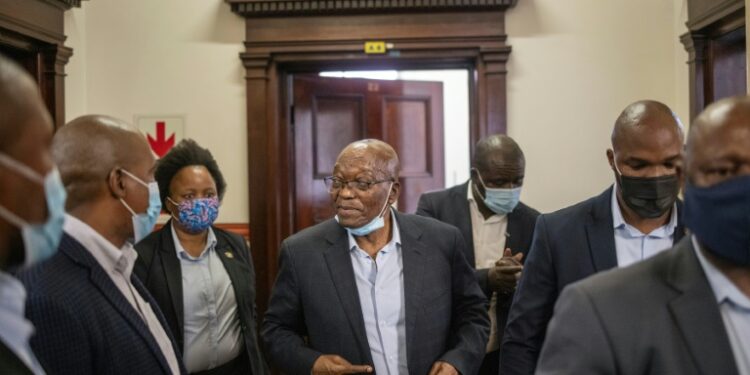 Zuma (C) was released from prison early due to ill health | AFP