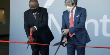 Scissor ceremony: President Cyril Ramaphosa, left, joins biotech tycoon Patrick Soon-Shiong in launching the vaccine hub | AFP