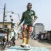A statue of Samuel Eto'o in the green, yellow and red of Cameroon stands in the New Bell neighborhood of Douala where he grew up | AFP