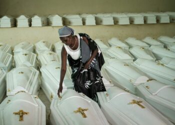 A survivor of the genocide, pictured in Kigali before a mass burial of victims in 2019 | AFP
