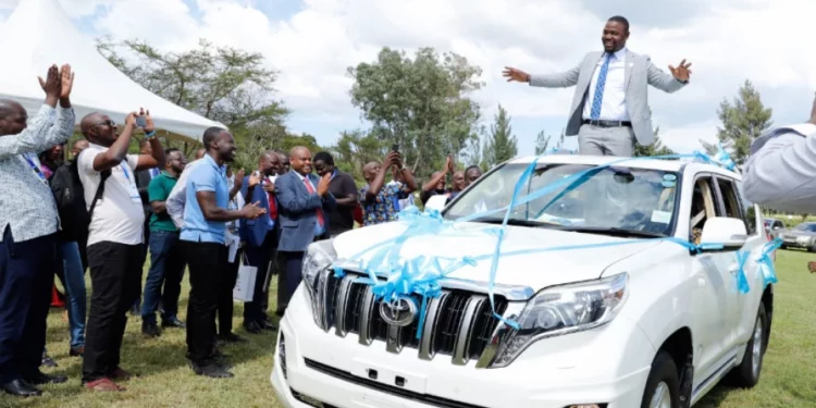KMPDU Secretary General Dr. Davji Bhimji Atellah atop the vehicle he was gifted by Kenyan doctors.Photo/Courtesy