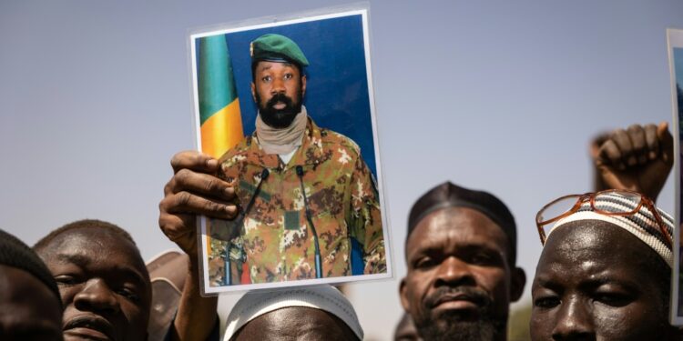 Support: Demonstrators at a rally in the Burkinabe capital Ouagadougou in January 2022 hold up a picture of Malian junta leader Colonel Aissimi Goita | AFP
