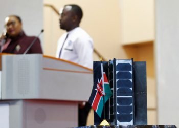 A model of a prototype of a 3U Earth observation satellite, the Taifa-1, is displayed at the University of Nairobi's Taifa Hall in Nairobi, Kenya, on April 14, 2023, as delegates witness the preparations for the launch of Kenya's first operational satellite. SayariLabs and EnduroSat have designed and developed the Taifa-1 satellite, which will be launched aboard a SpaceX Falcon-9 rocket to capture agricultural data that will be used to combat food insecurity | Photo Courtesy