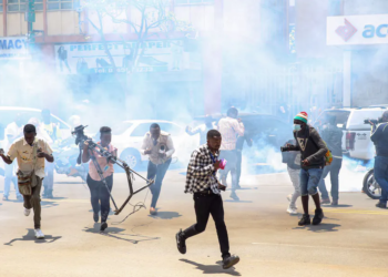 Journalists take cover during March 2023 protests in Kenya | Boniface Muthoni/SOPA Images