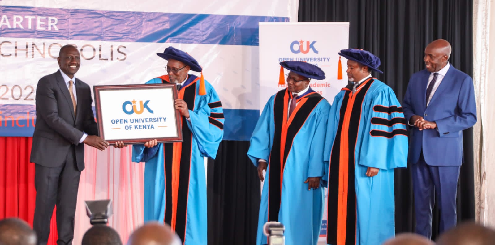President William Ruto awards charter to Open University of Kenya.
