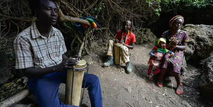 Rastafarians drum and sing during a special prayer and worship meeting at Menengai forest in Kenya. James Wakibia/SOPA Images/LightRocket via Getty Images