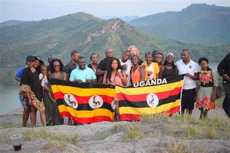 A group of millennials pose at a loftier altitude overlooking the twin lakes in Rubirizi district, Queen Elizabeth National Park in Uganda.