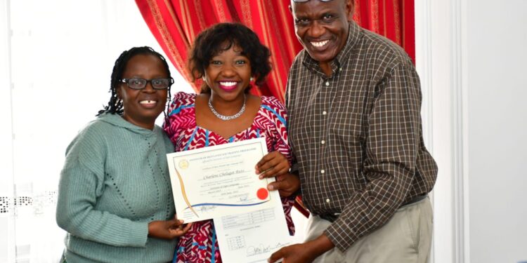 First daughter Charlene Ruto poses for a photo with her teacher (left) and examiner after graduating with a certificate in Kenyan Sign Language.