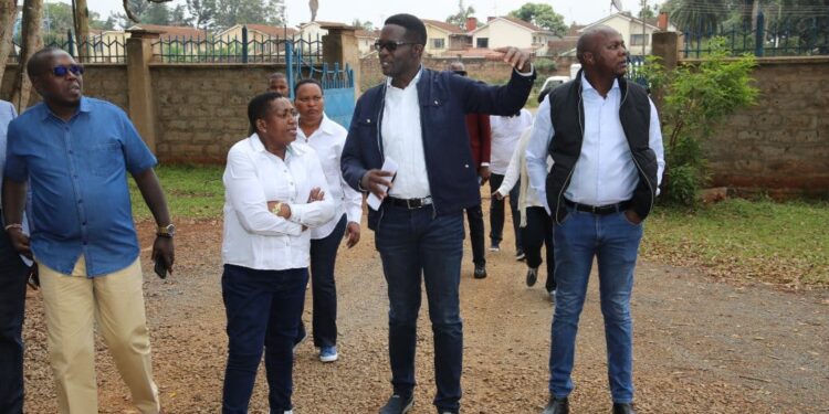 CA Board Chairperson Mary Wambui (second from left) and suspended CA Director General Ezra Chiloba (second from right) join other officials in inspecting a digital superhighway project.