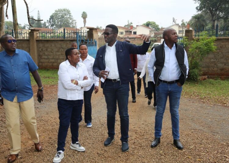 CA Board Chairperson Mary Wambui (second from left) and suspended CA Director General Ezra Chiloba (second from right) join other officials in inspecting a digital superhighway project.