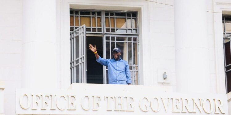 Nairobi Governor Johnson Sakaja waves from City Hall's balcony in Nairobi.