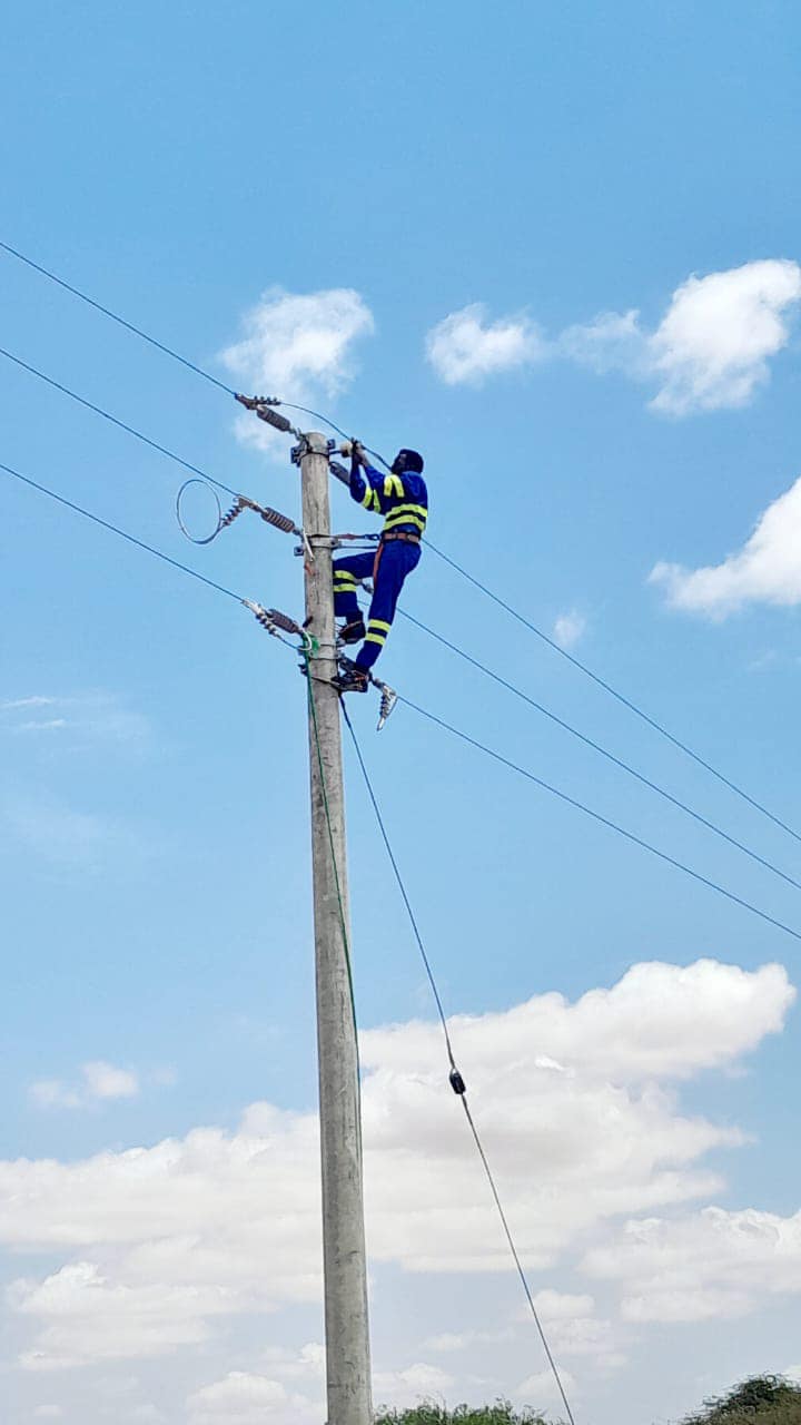A KPLC employee working on Electricity lines PHOTO/KPLC