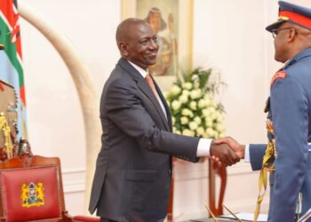 President William Ruto shakes hands with Chief of Defence Forces General Francis Ogolla.