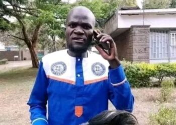 Azimio supporter Nuru Okanga speaks on phone during a past political function.